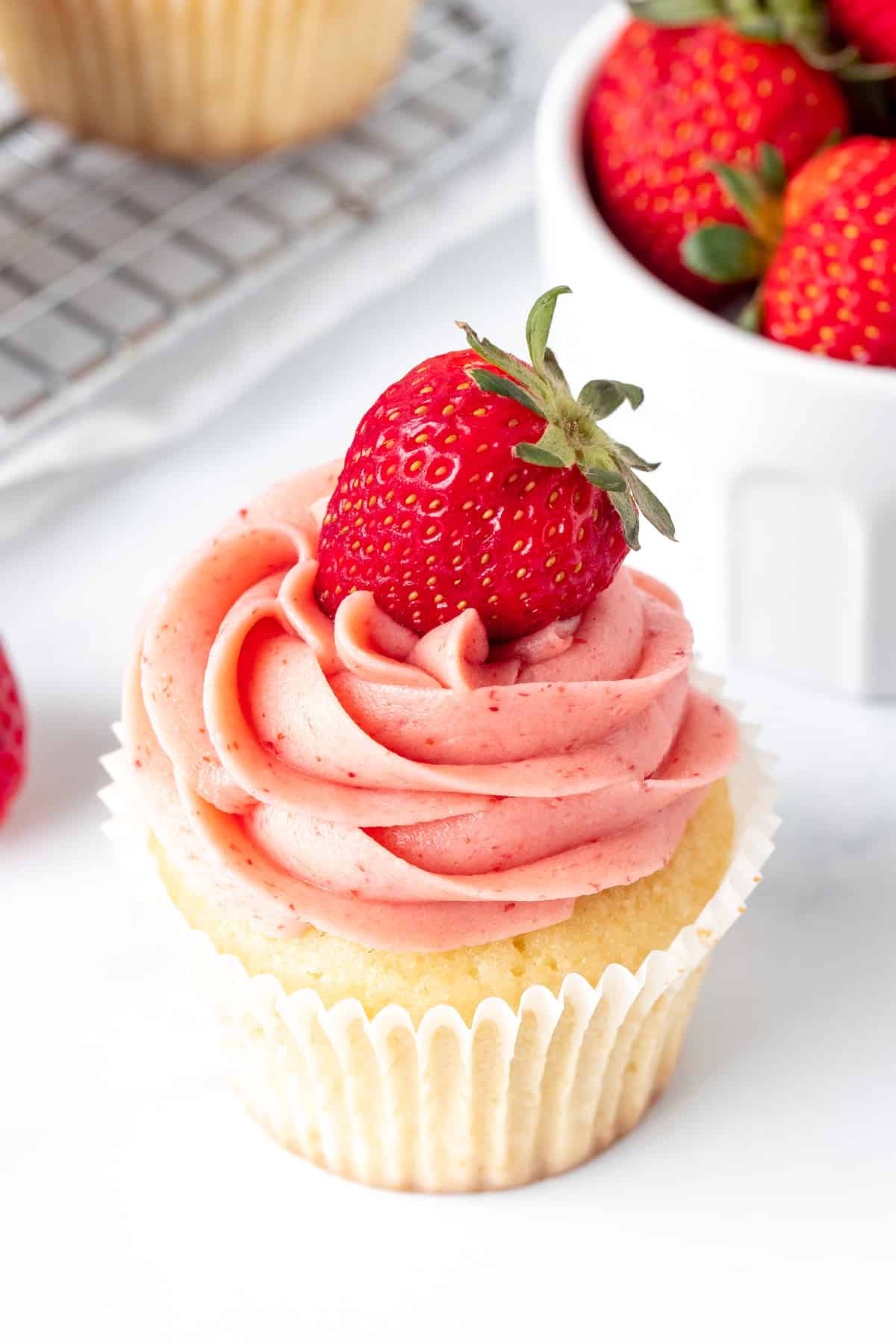 Vanilla cupcake with strawberry buttercream frosting