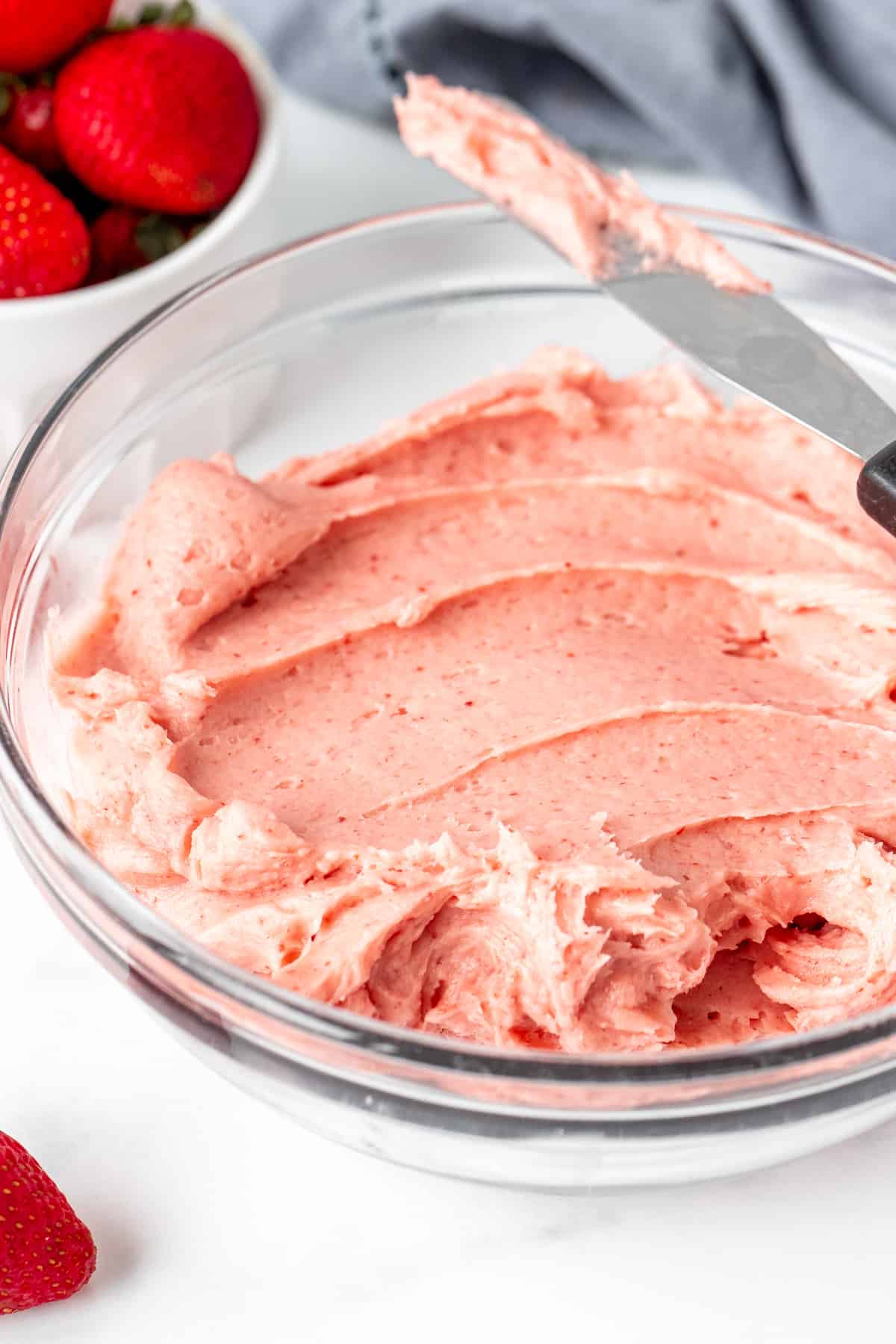 Bowl of creamy strawberry frosting