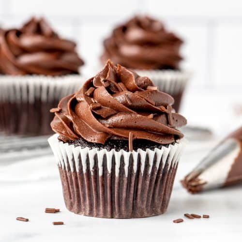 Chocolate cupcake piped with chocolate frosting