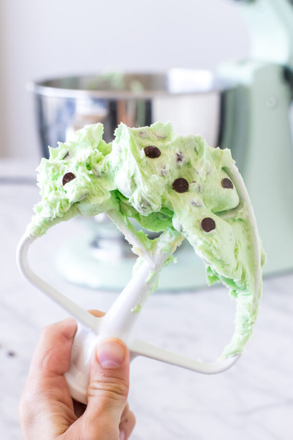 Stand mixer paddle attachment with mint chip frosting. 