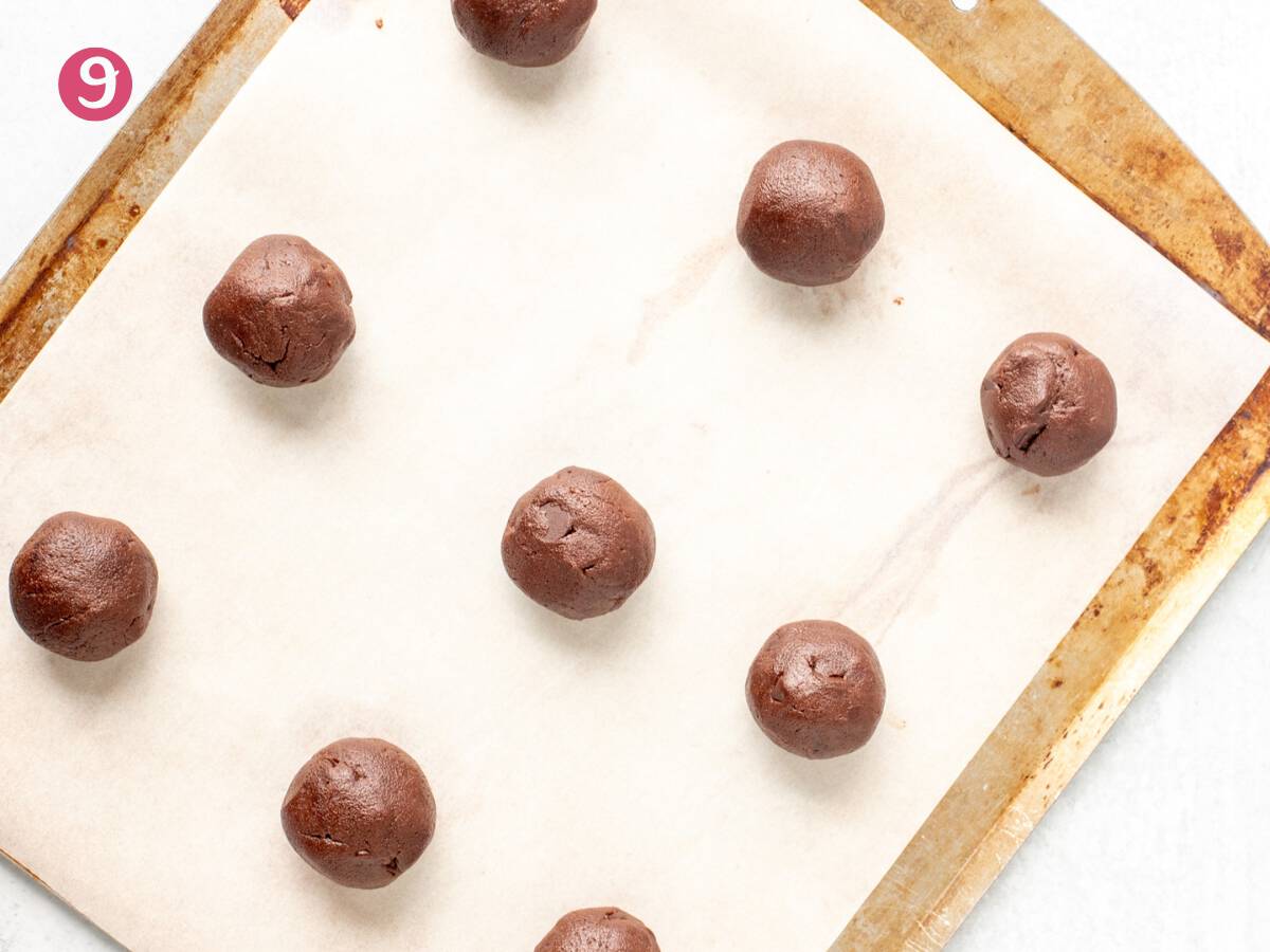 Nutella cookie dough balls on lined cookie tray