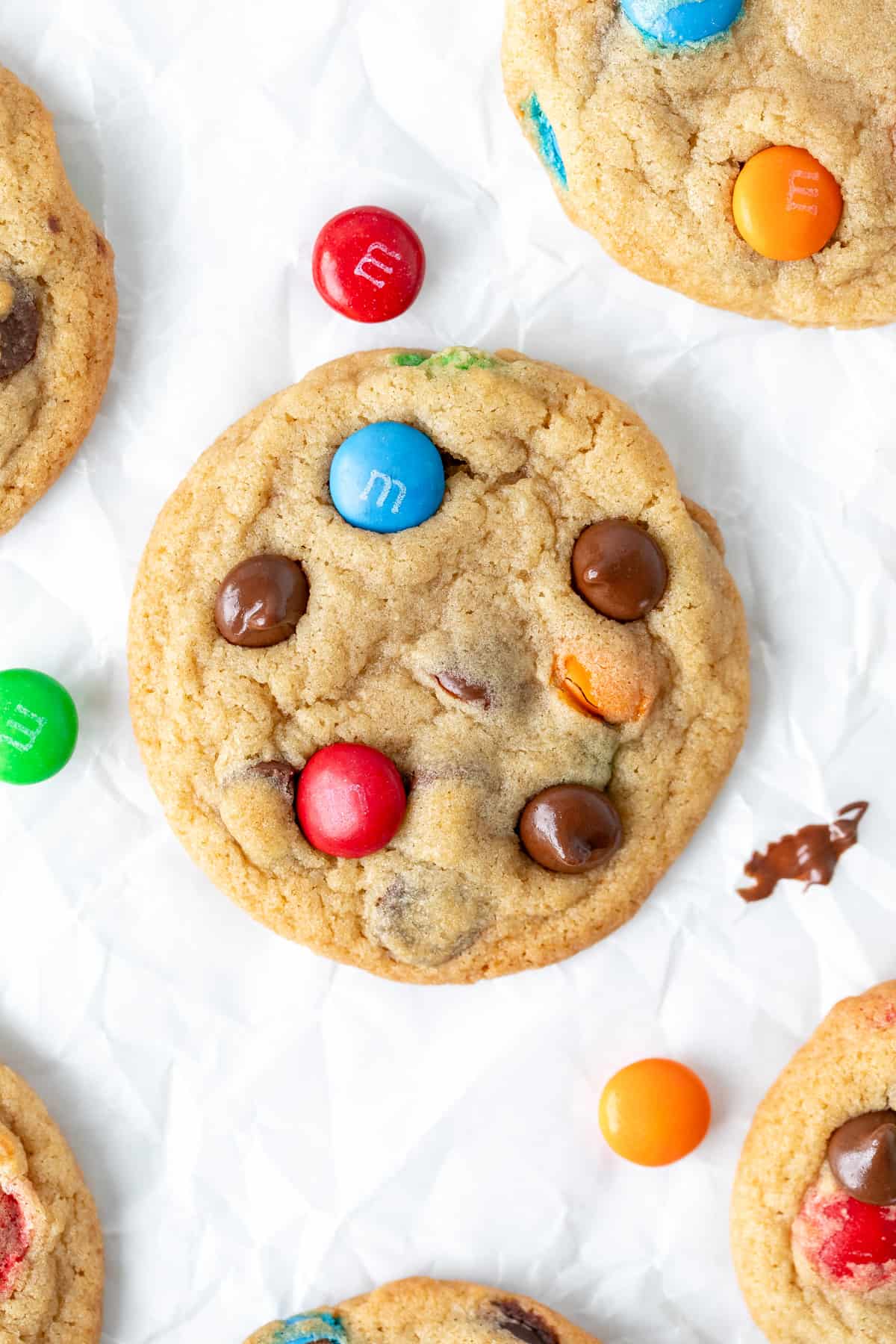 M&M chocolate chip cookies on baking paper