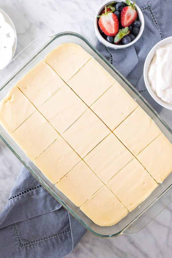 9x13 inch pan of cheesecake, cut into squares.