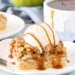 Apple crisp bar with a scoop of ice cream and caramel drizzle on top.