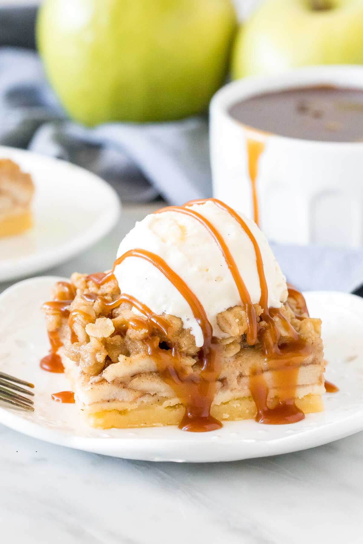Apple crisp bar with a scoop of ice cream and caramel drizzle on top. 