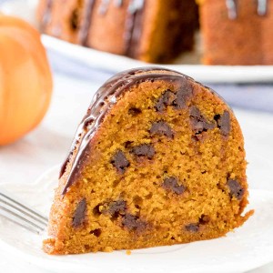 Slice of pumpkin chocolate chip cake on a a plate.
