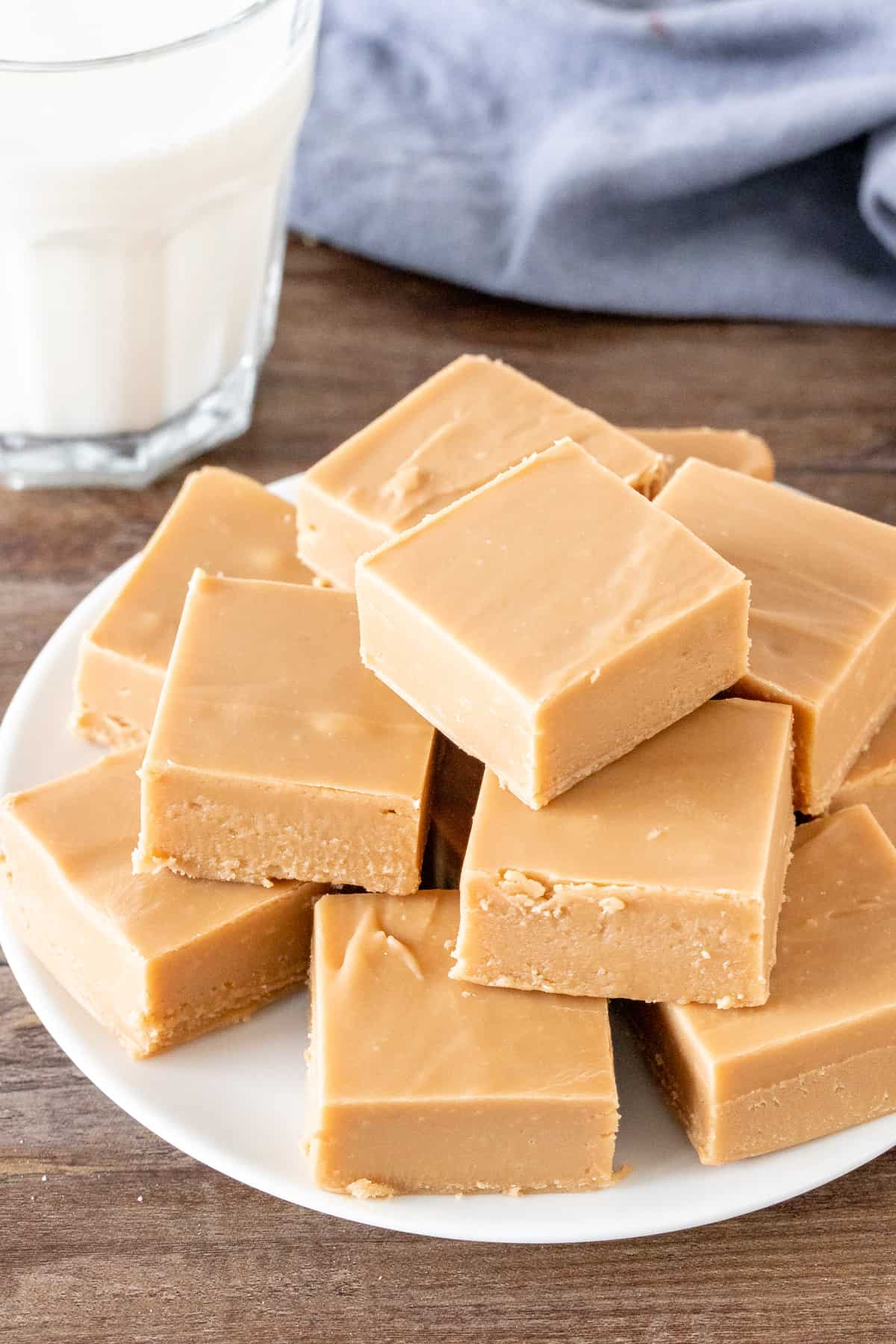 Plate of caramel fudge with glass of milk