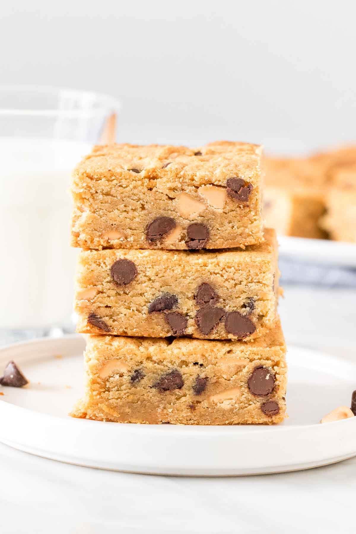 Stack of 3 peanut butter cookie bars with chocolate chips. 