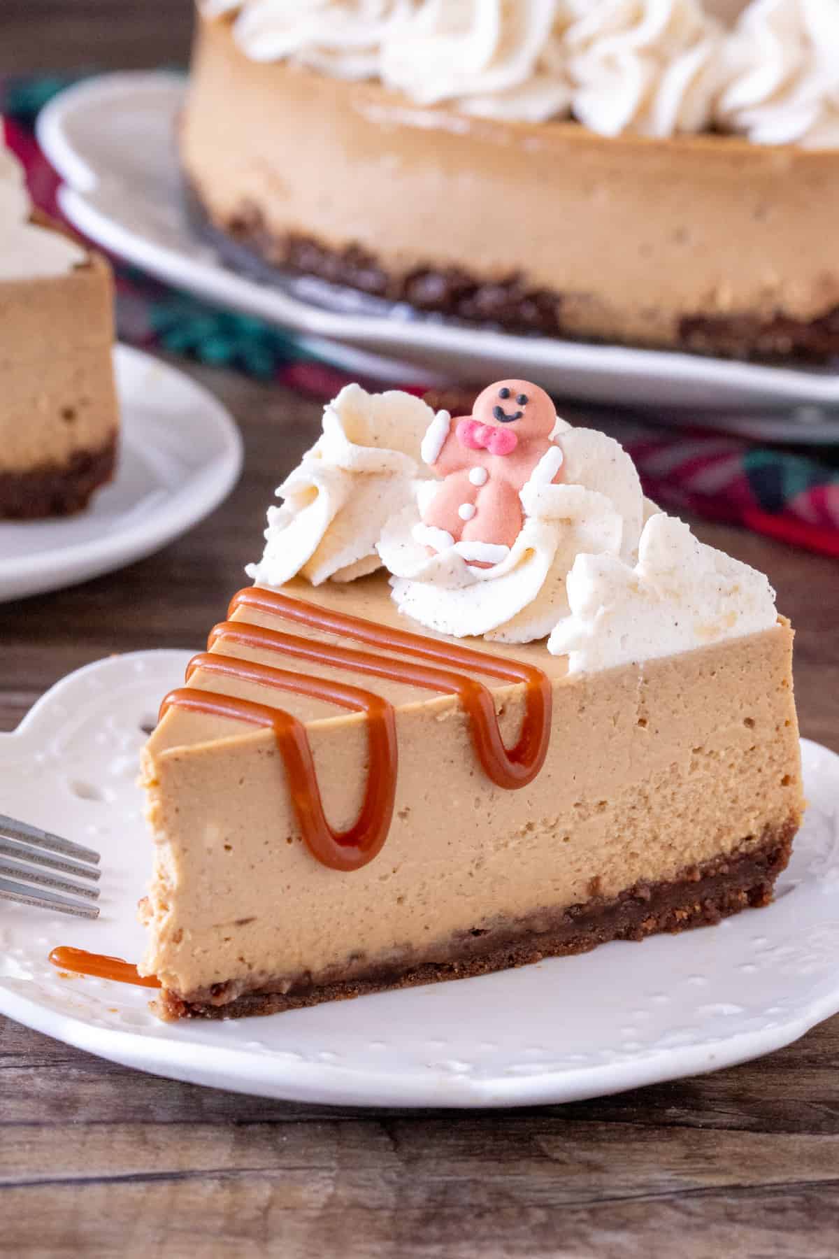 Slice of gingerbread cheesecake with caramel sauce.