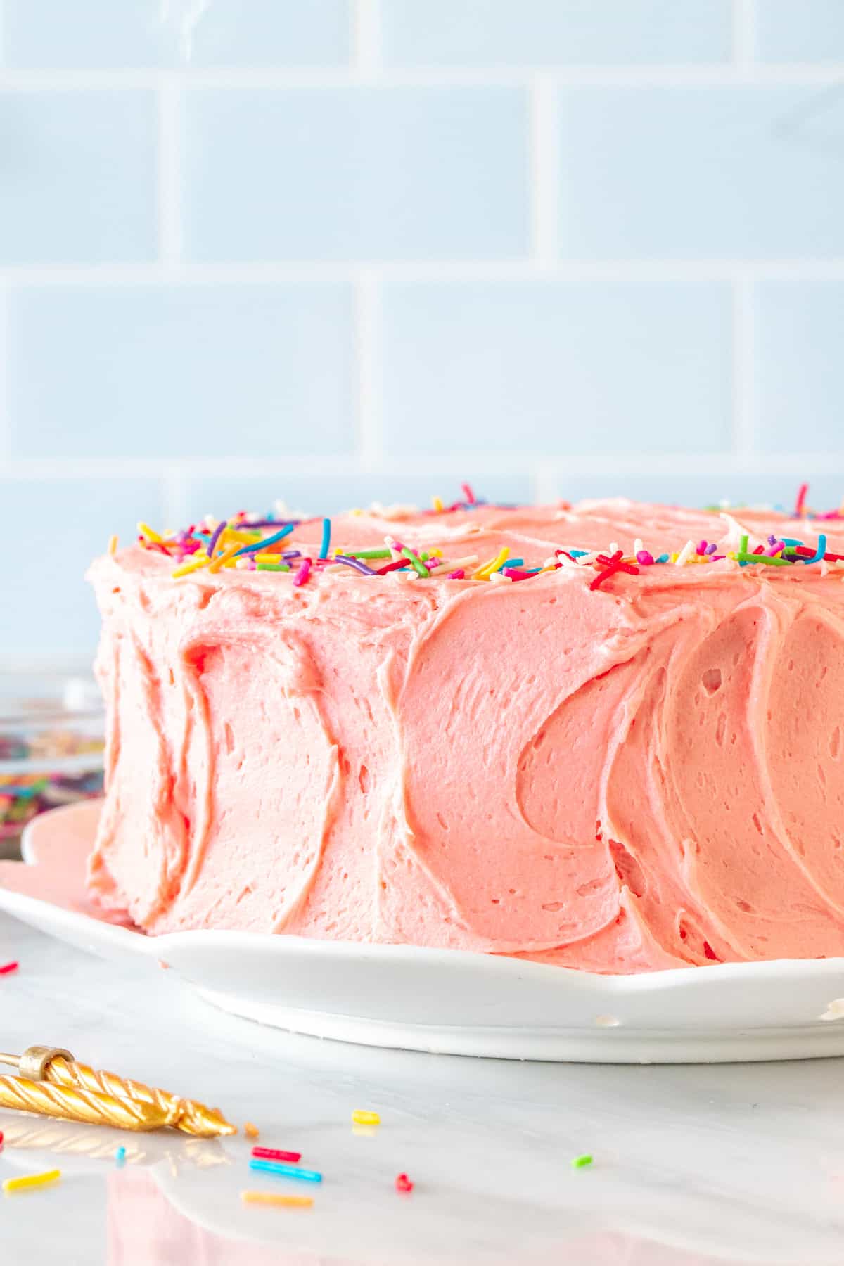 Birthday cake with pink frosting and sprinkles