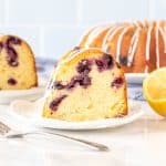 Slice of lemon blueberry bundt cake with fork