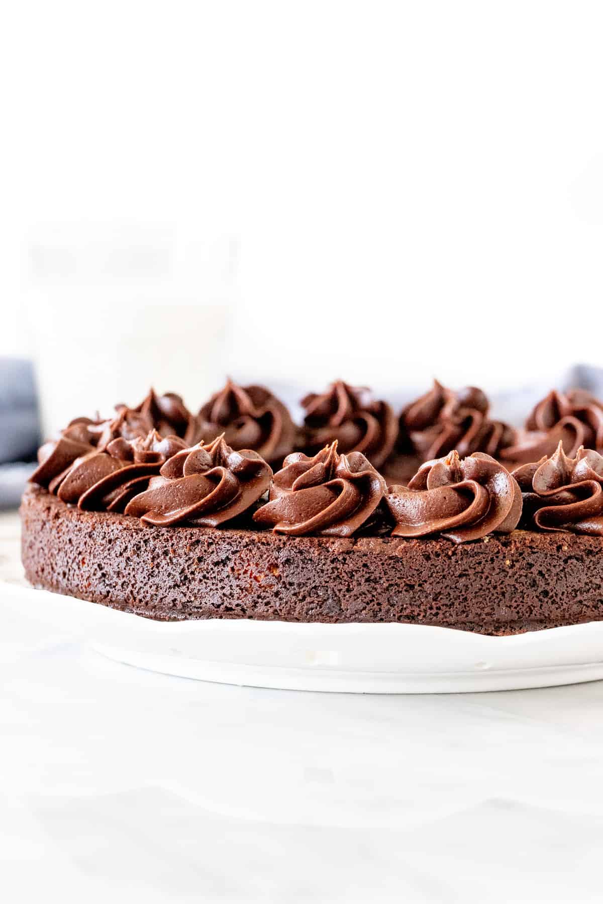 Chocolate cookie cake with chocolate frosting piped around the edges