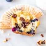 Half of a blueberry chocolate chip muffin.