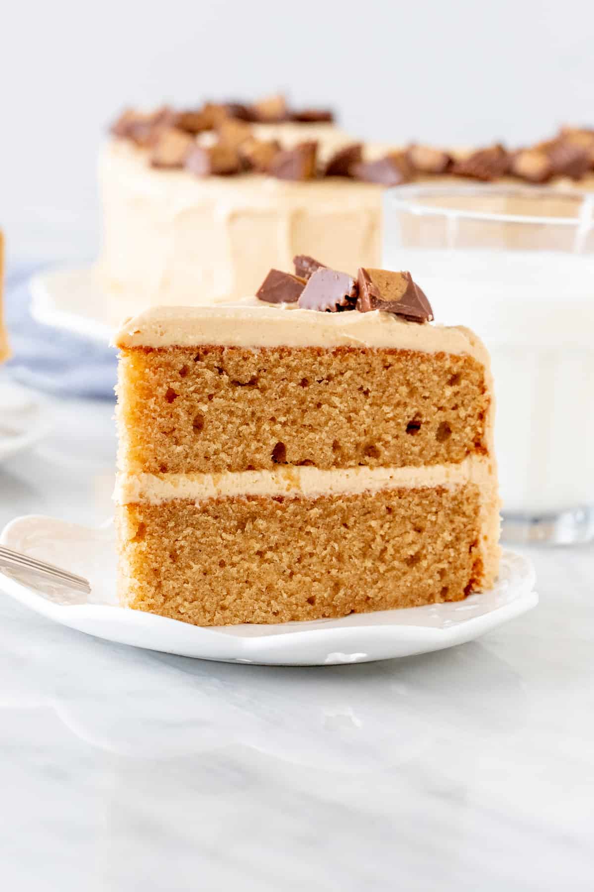 Slice of moist peanut butter cake with peanut butter frosting