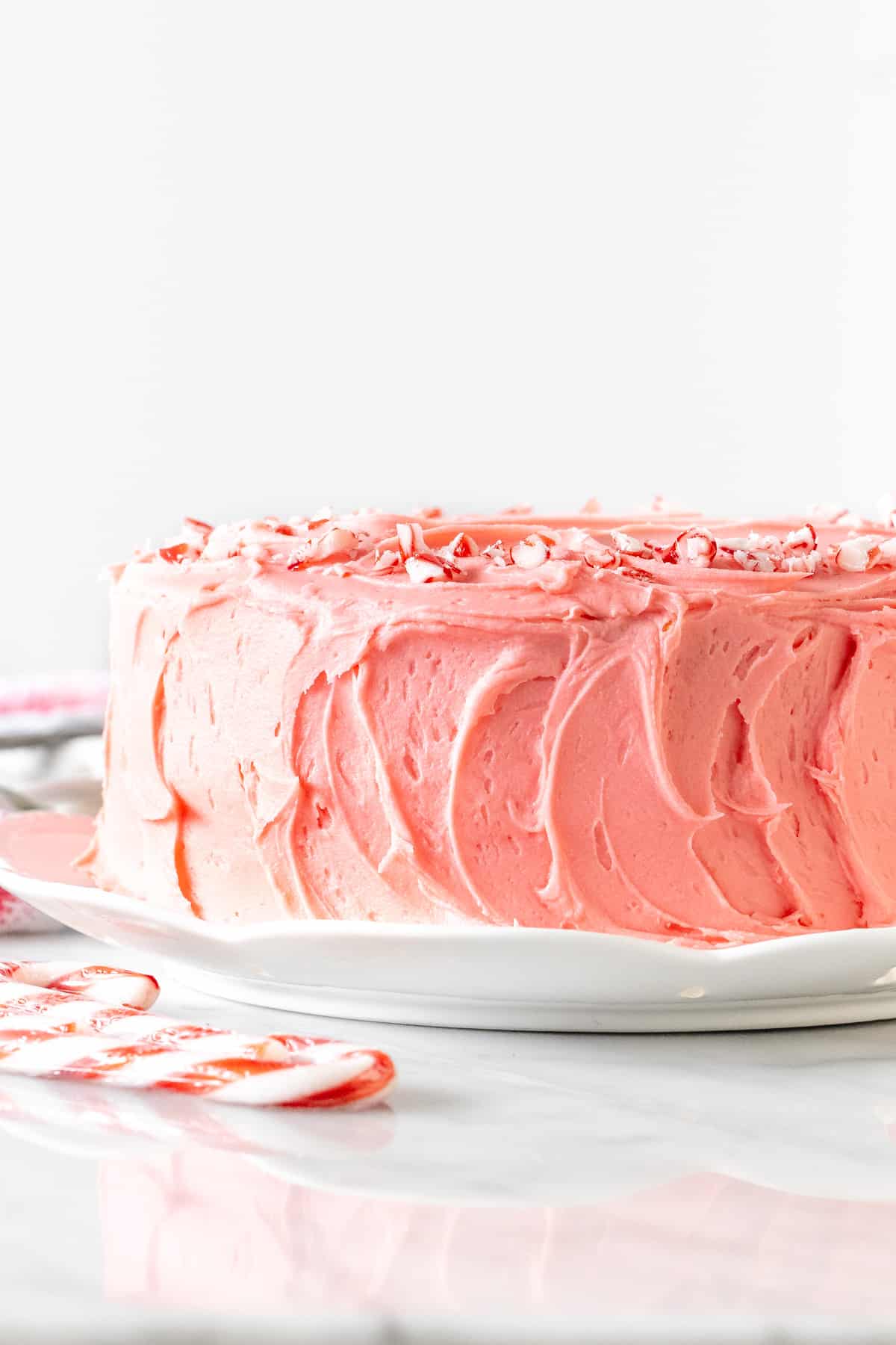 Candy cane cake with pink peppermint frosting