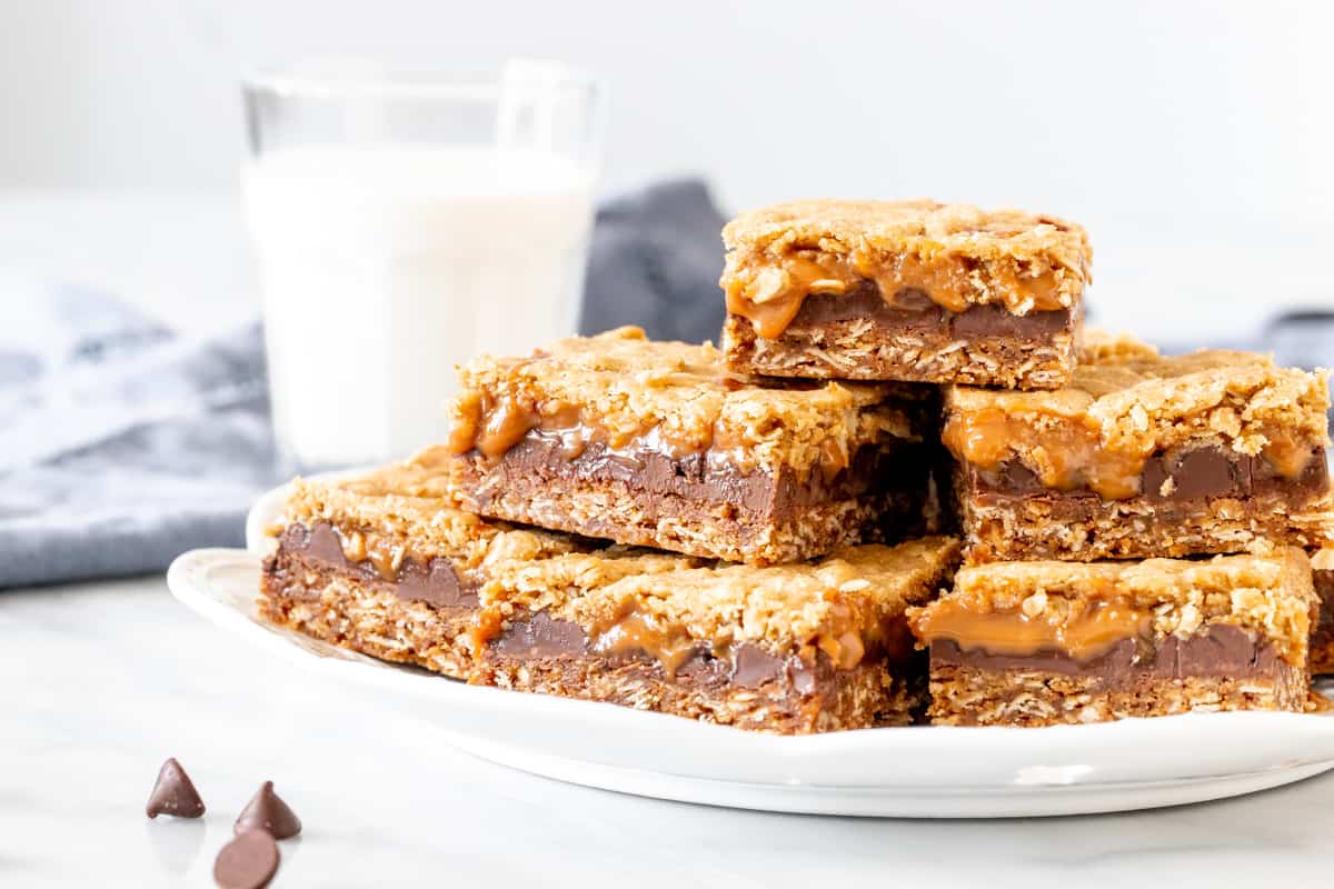 Plate of caramel oatmeal bars with glass of milk