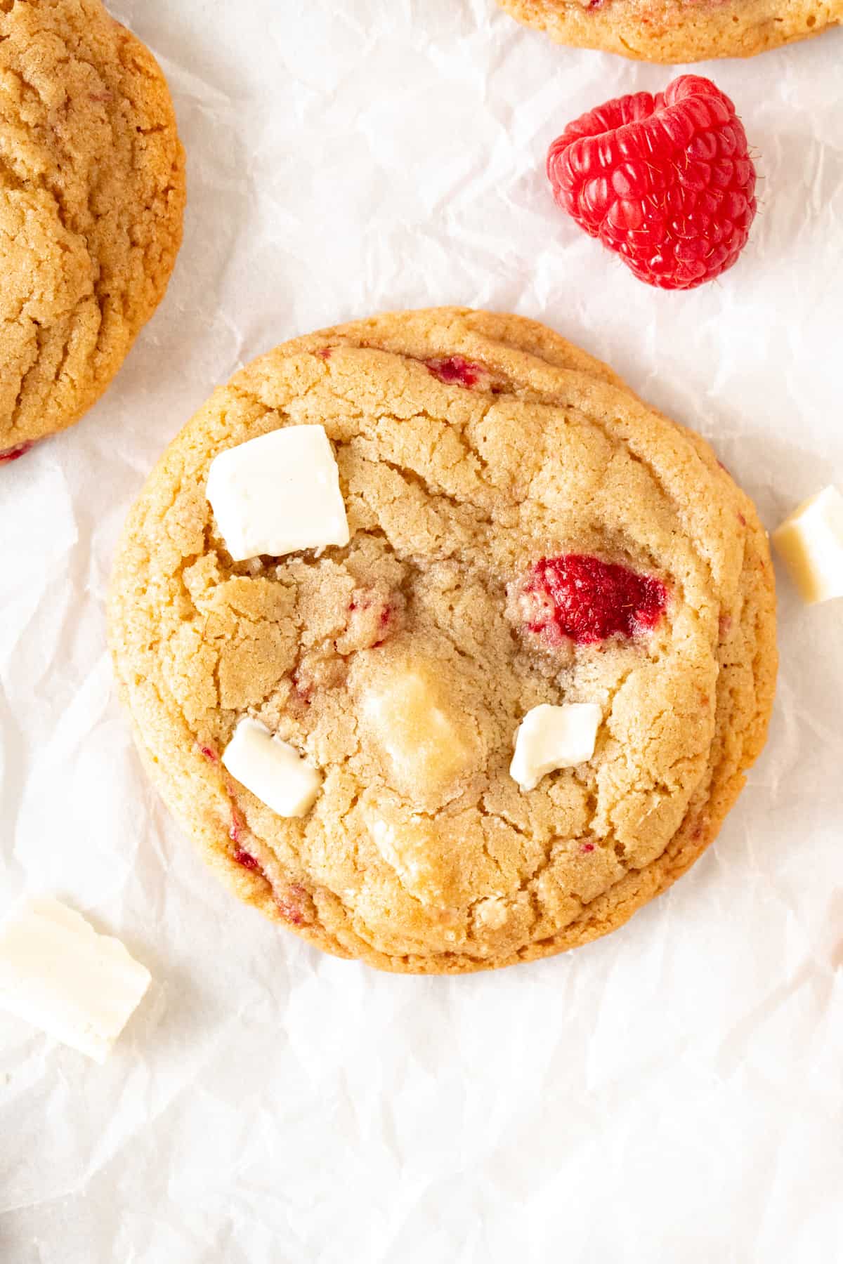 White chocolate raspberry cookie on baking paper