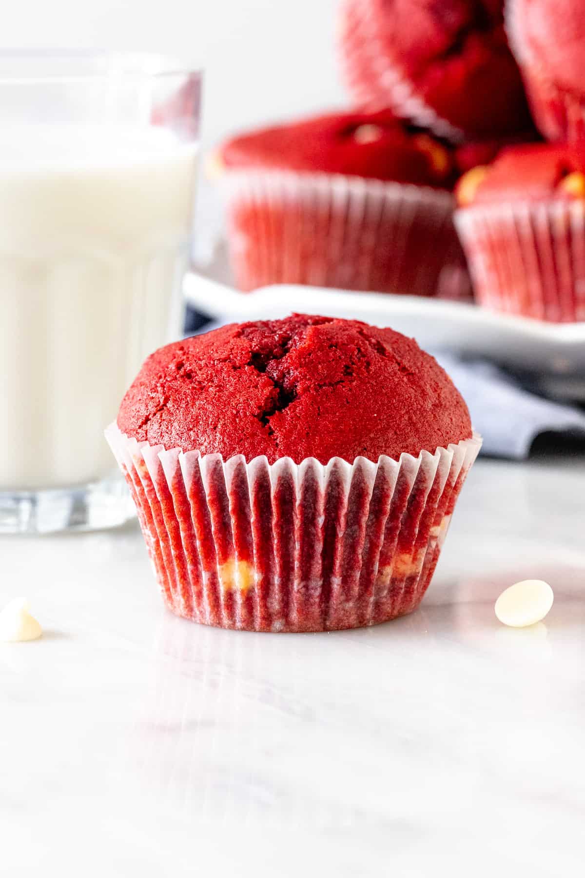 Red velvet chocolate chip muffin with glass of milk