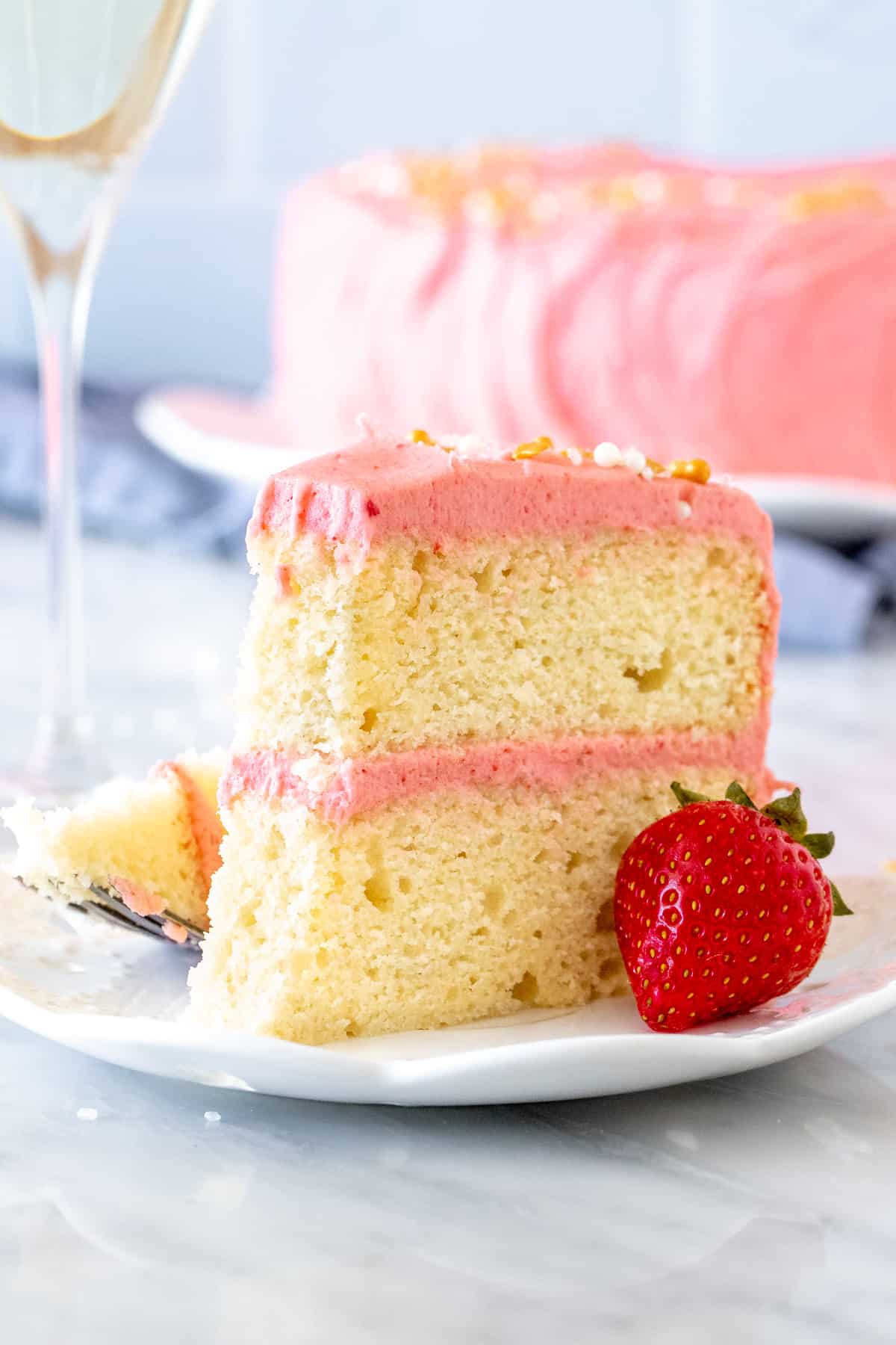 Slice of cake with pink strawberry frosting