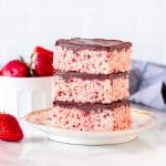 3 strawberry Rice Krispie treats with chocolate topping, stacked on top of each other