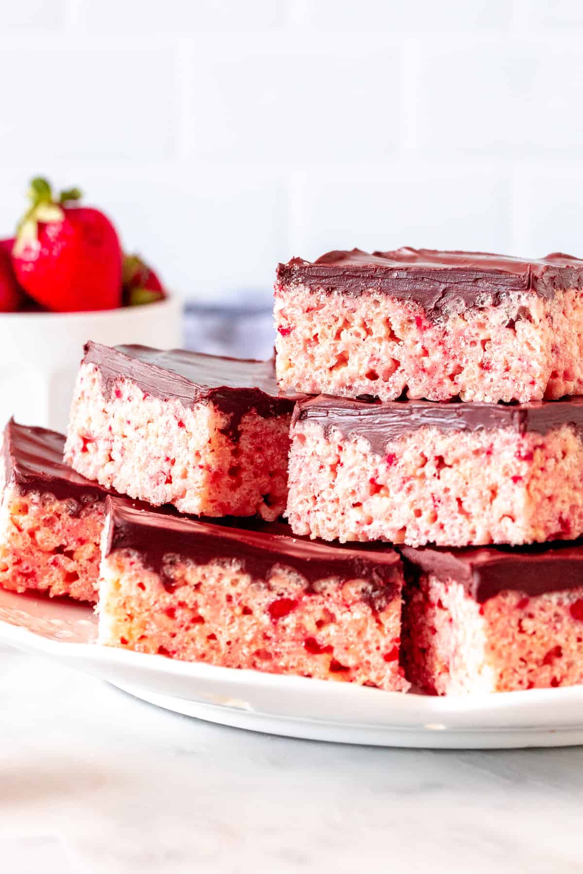 Plate of strawberry cereal treats with chocolate topping
