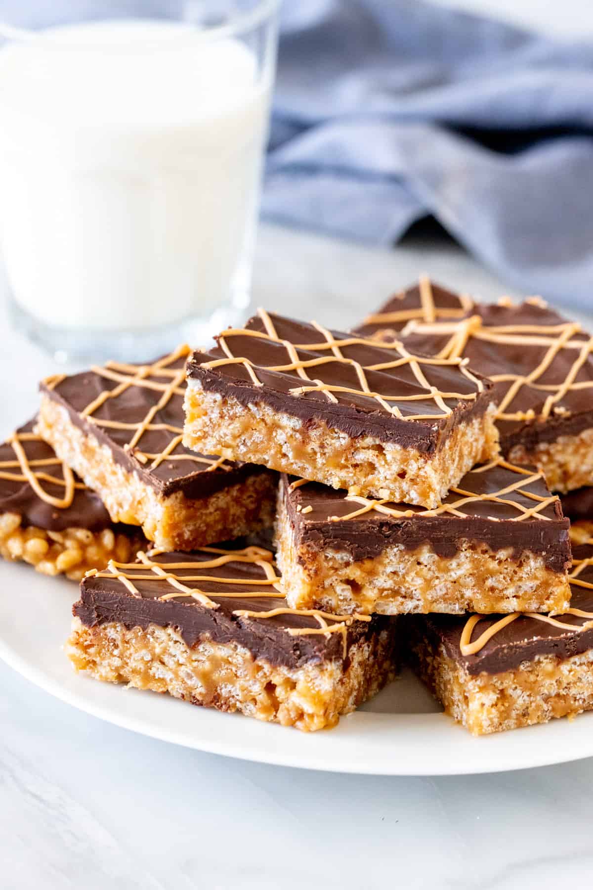 Plate of butterscotch Rice Krispie treats with chocolate on top