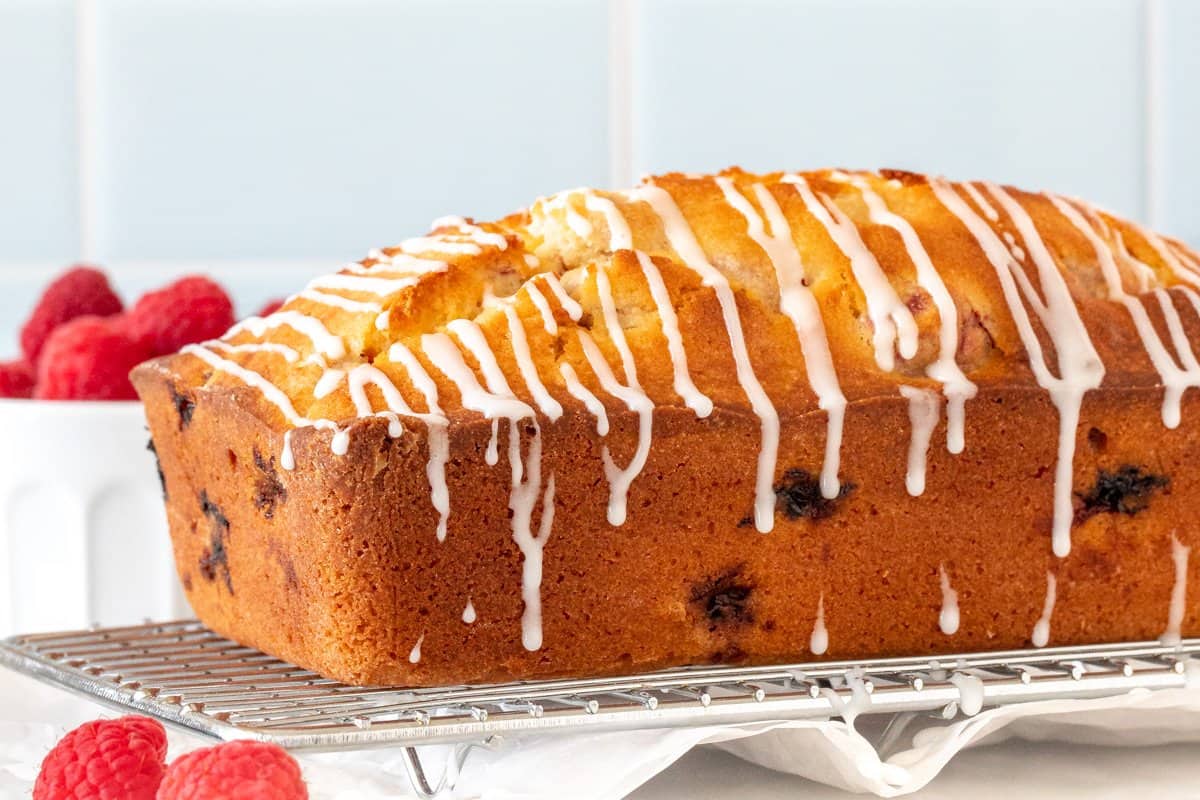 Raspberry bread loaf with drizzle of glaze
