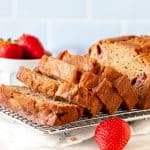 Strawberry banana bread with half the loaf sliced