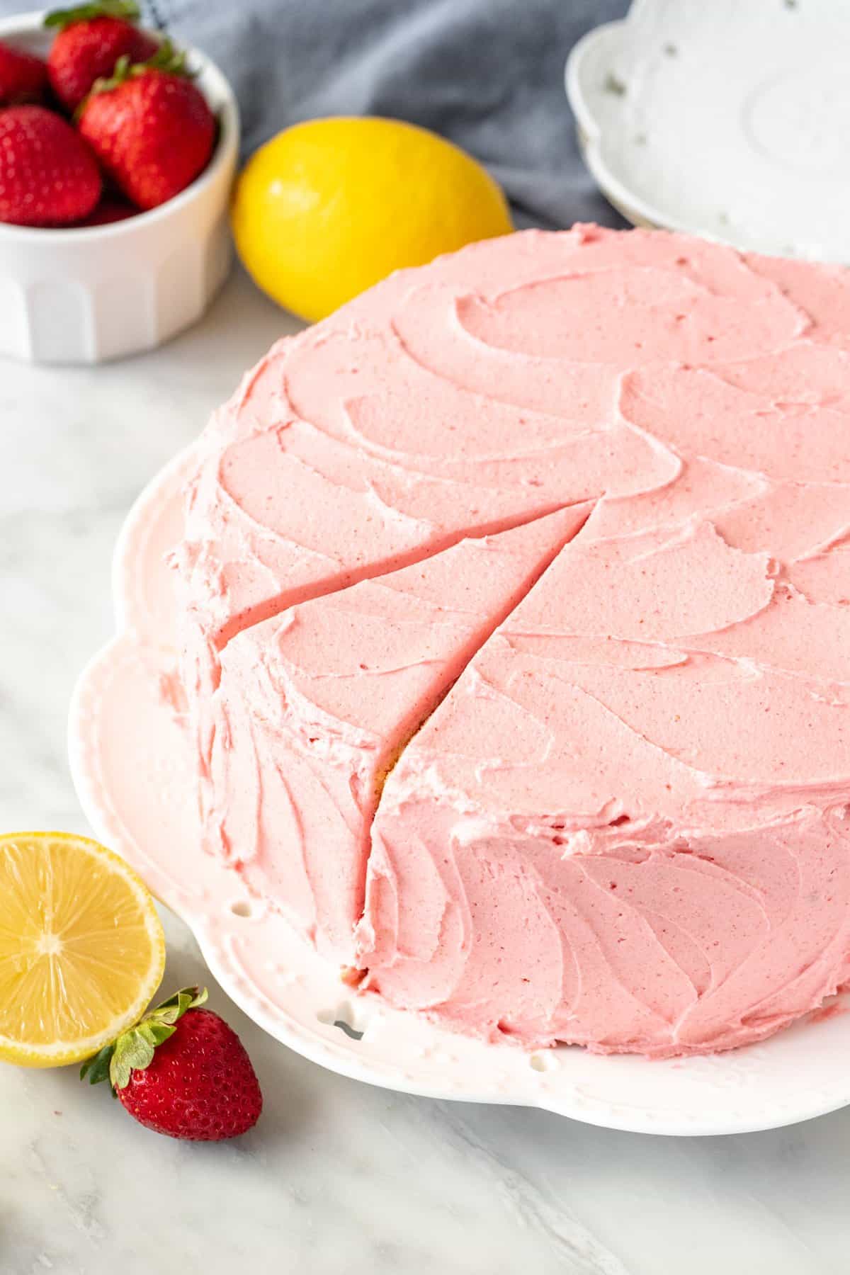 Round layer cake with strawberry frosting