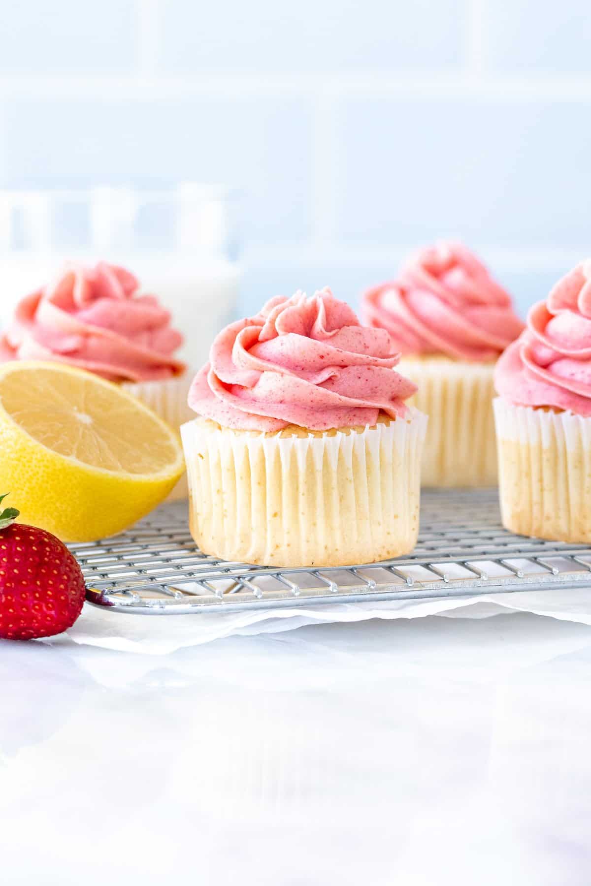 Strawberry lemonade cupcakes on a wire rack
