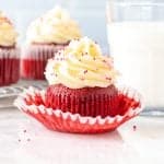 Red velvet cupcake with glass of milk