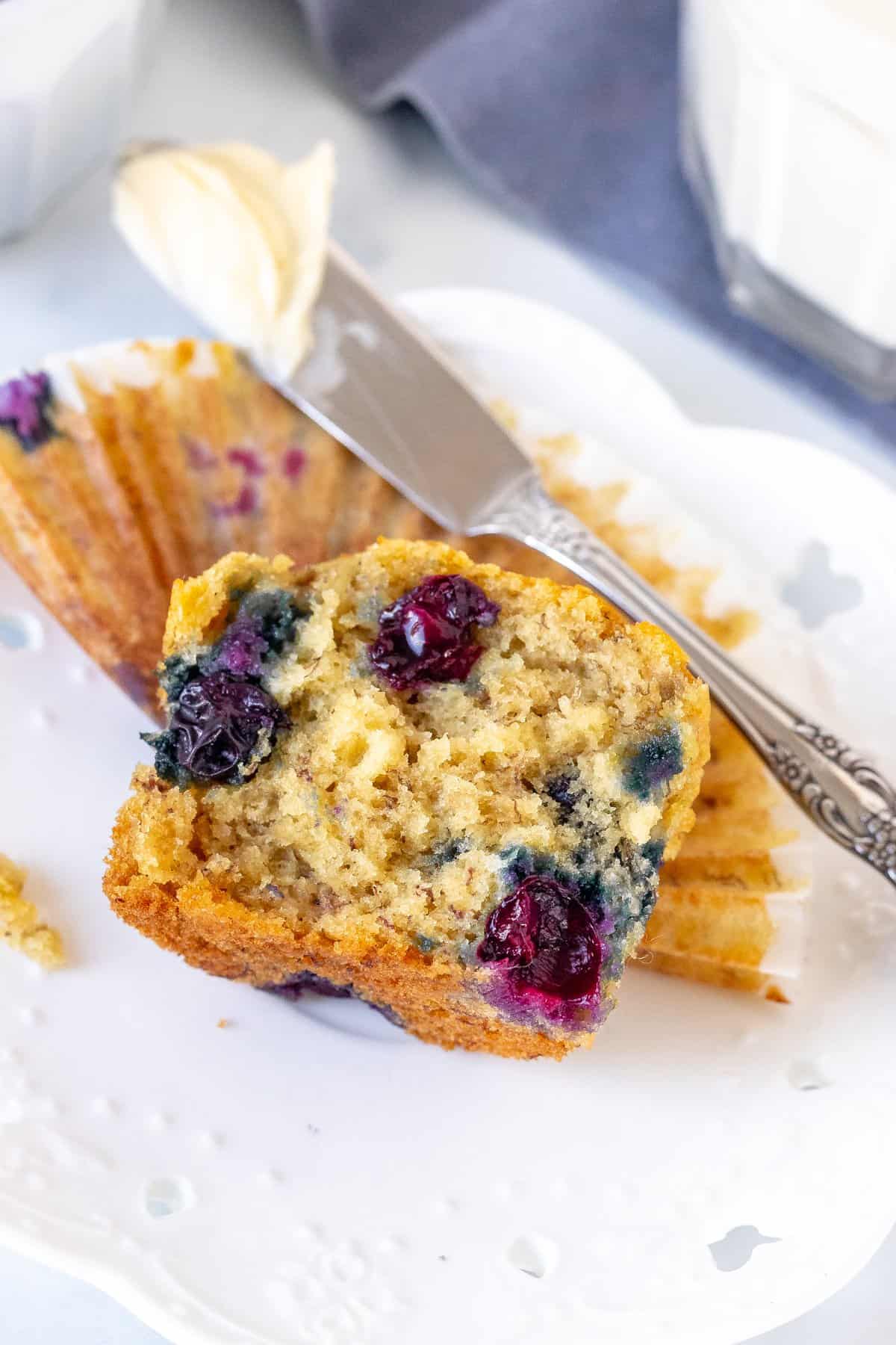 Banana muffin with blueberries broken in half