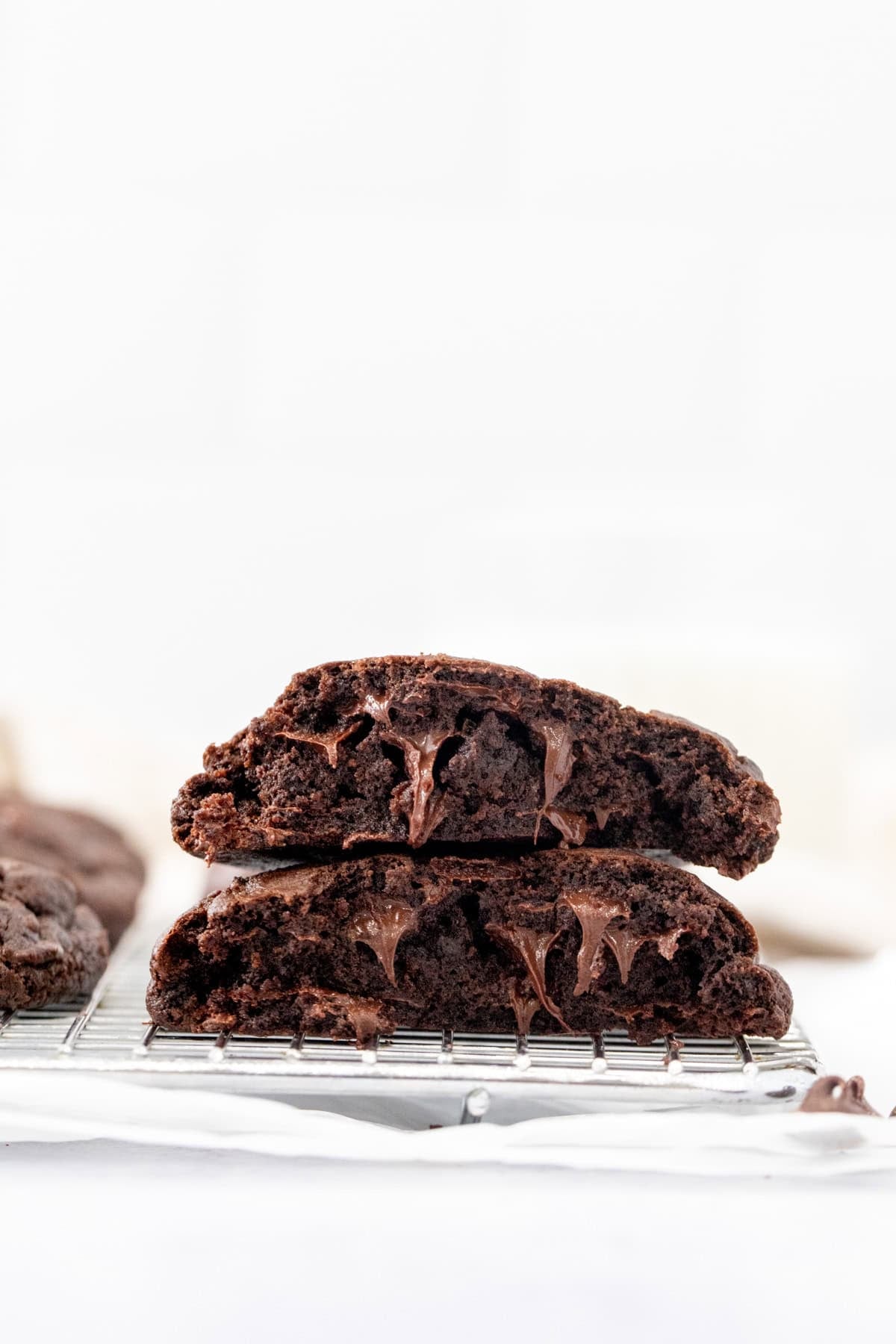 Extra thick double chocolate cookie broken in half