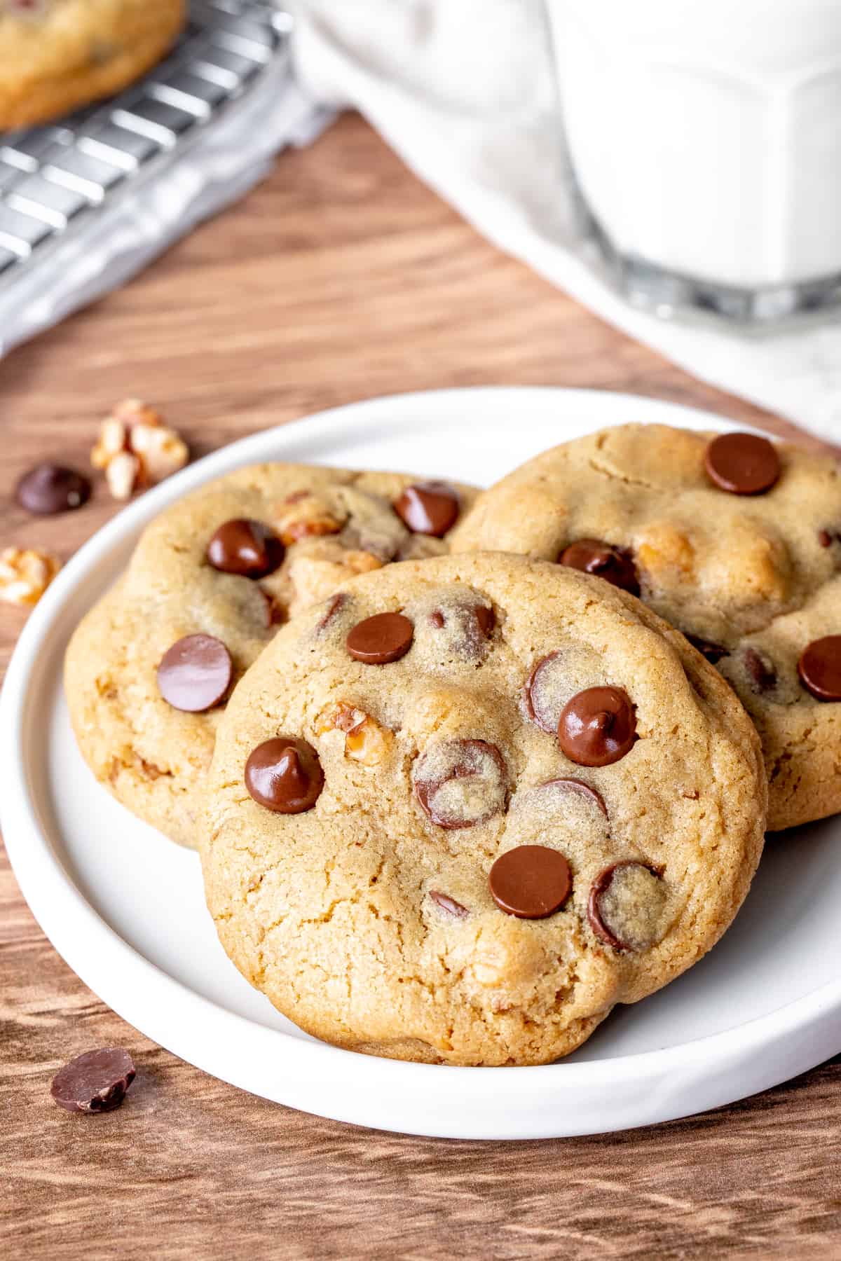 Plate of 3 chocolate chip cookies with walnuts