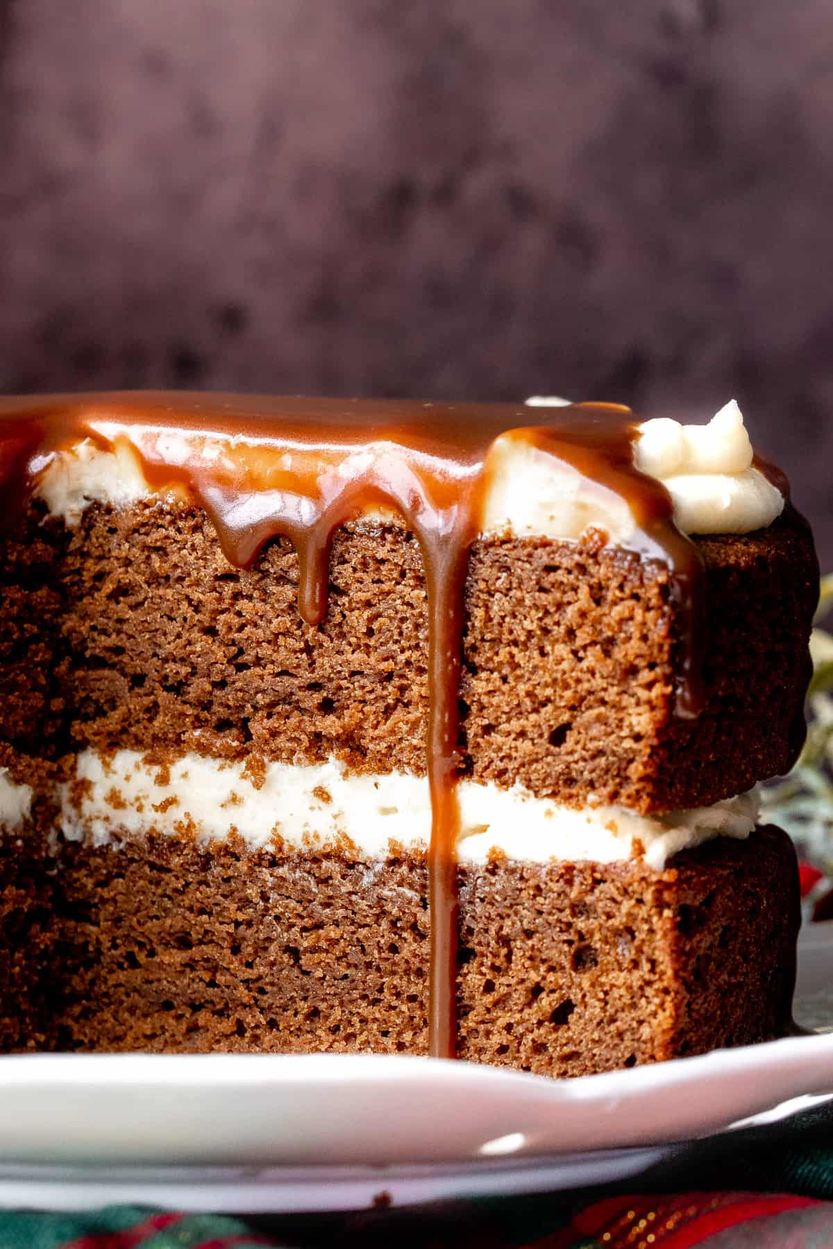 Gingerbread layer cake with cream cheese frosting and butterscotch dripping down