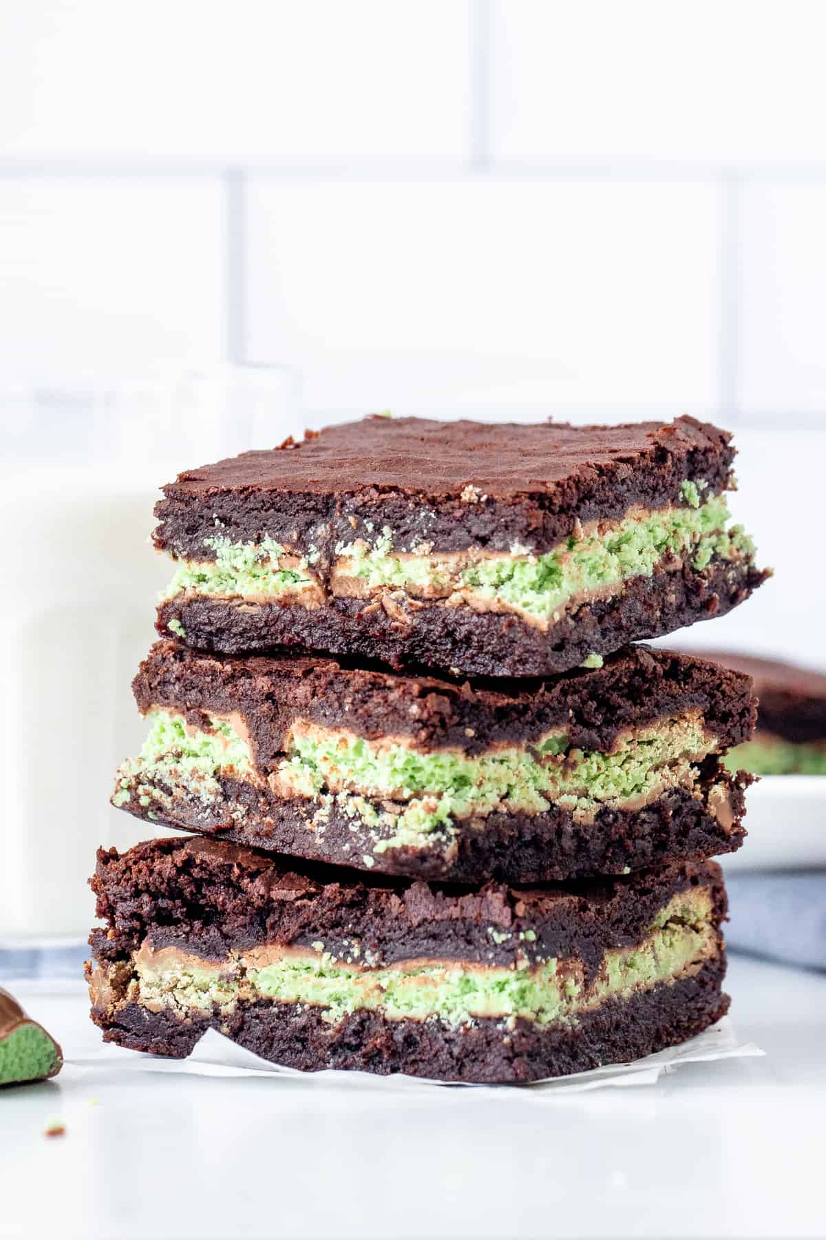 3 Mint Aero brownies with a glass of milk