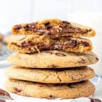 Stack of Nutella stuffed cookies with glass of milk