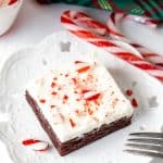 Brownie with white chocolate frosting and crushed candy canes on top