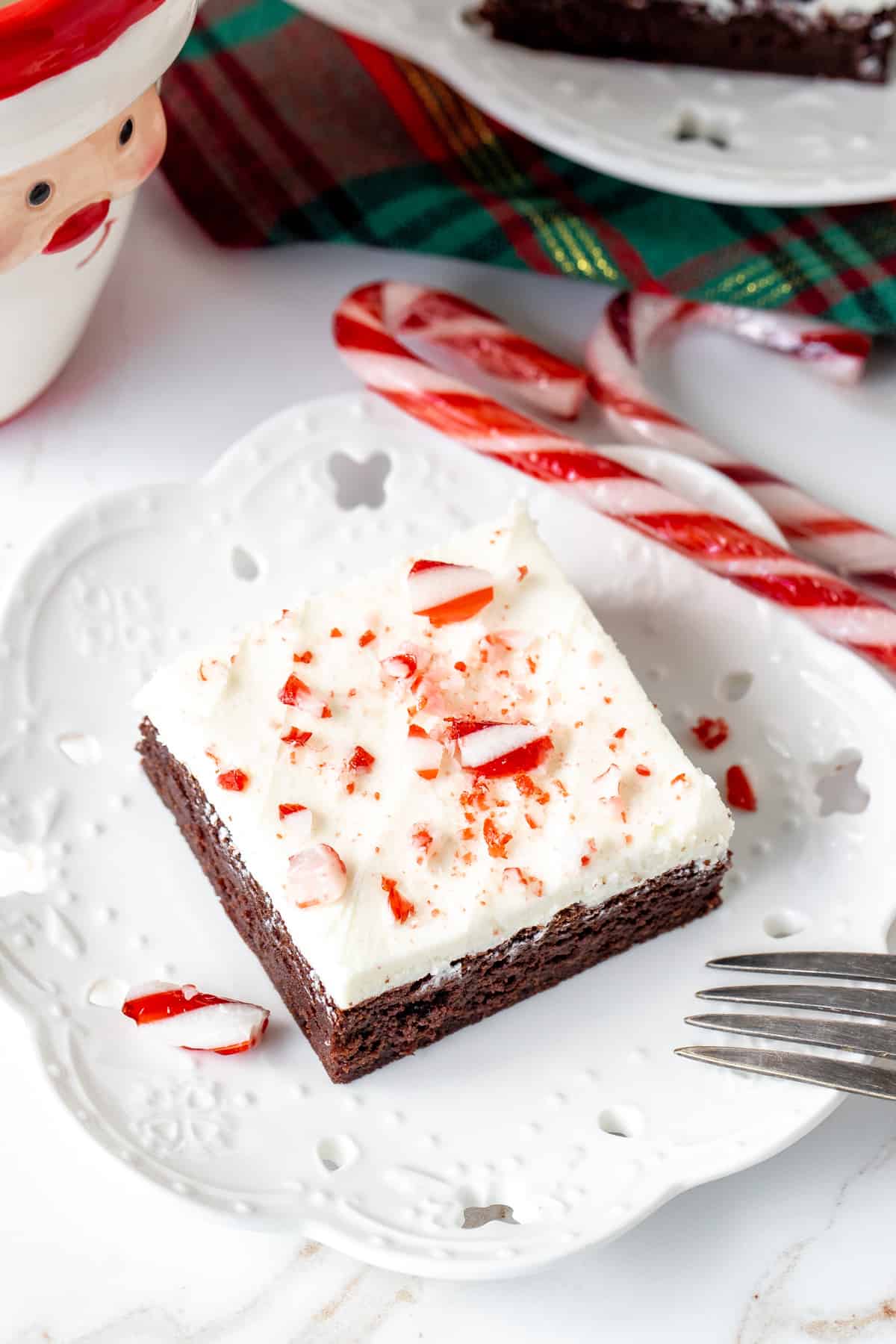 Brownie with white chocolate frosting and crushed candy canes on top