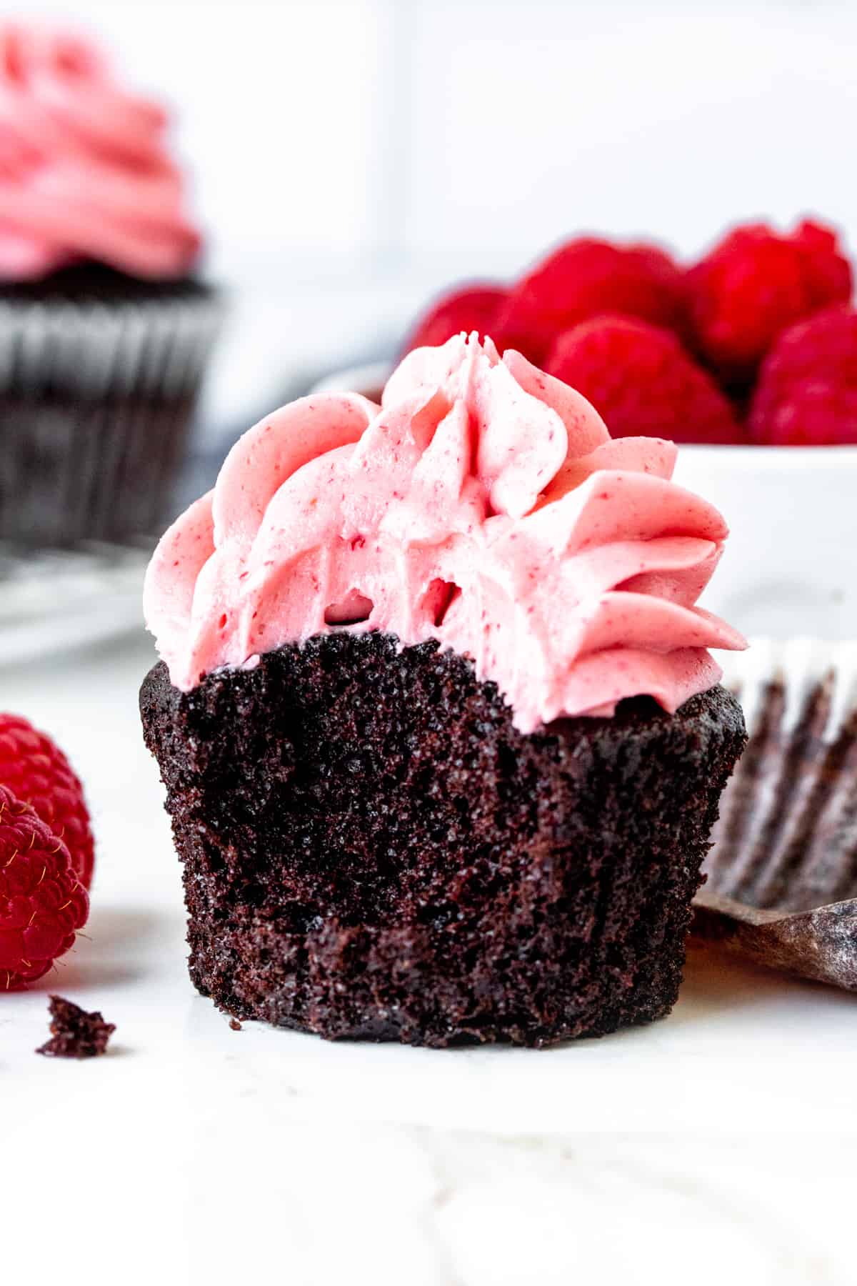 Chocolate raspberry cupcake with a bite taken out