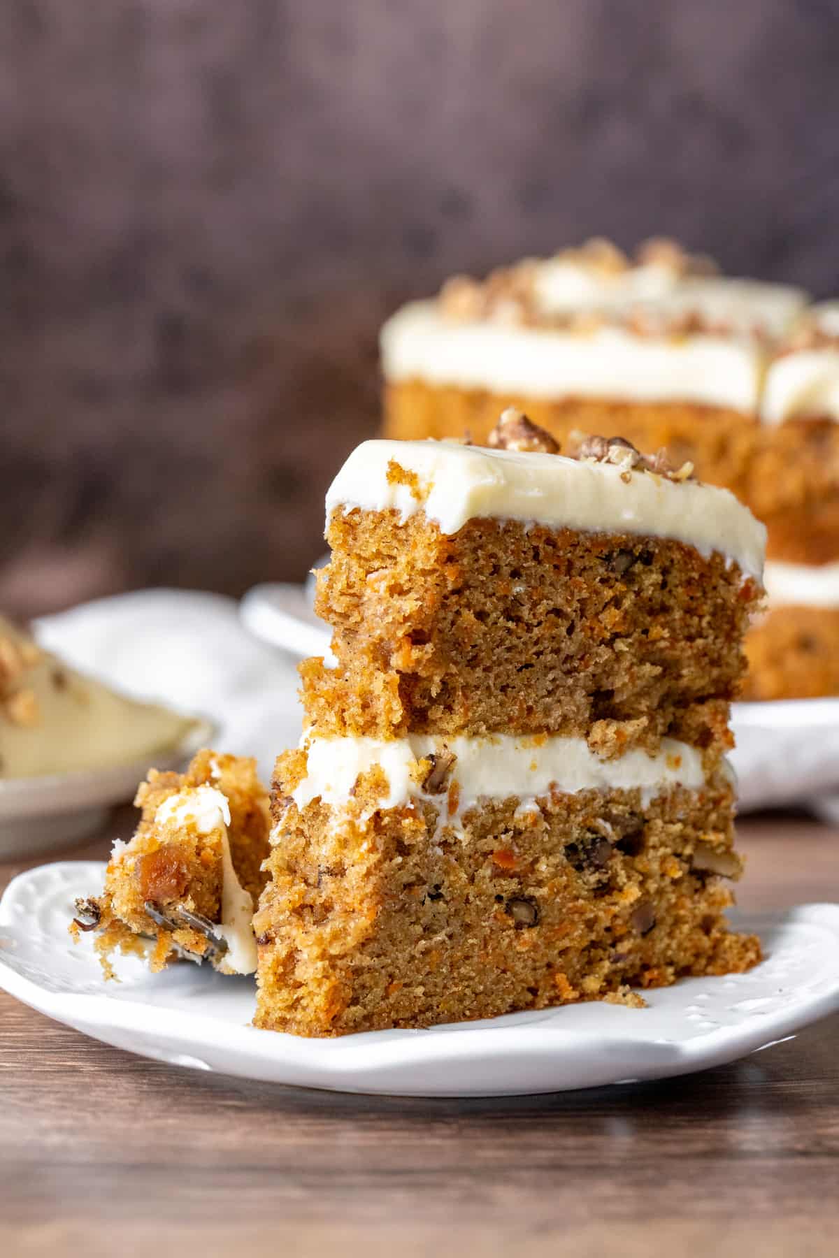 Slice of carrot cake with bite taken out