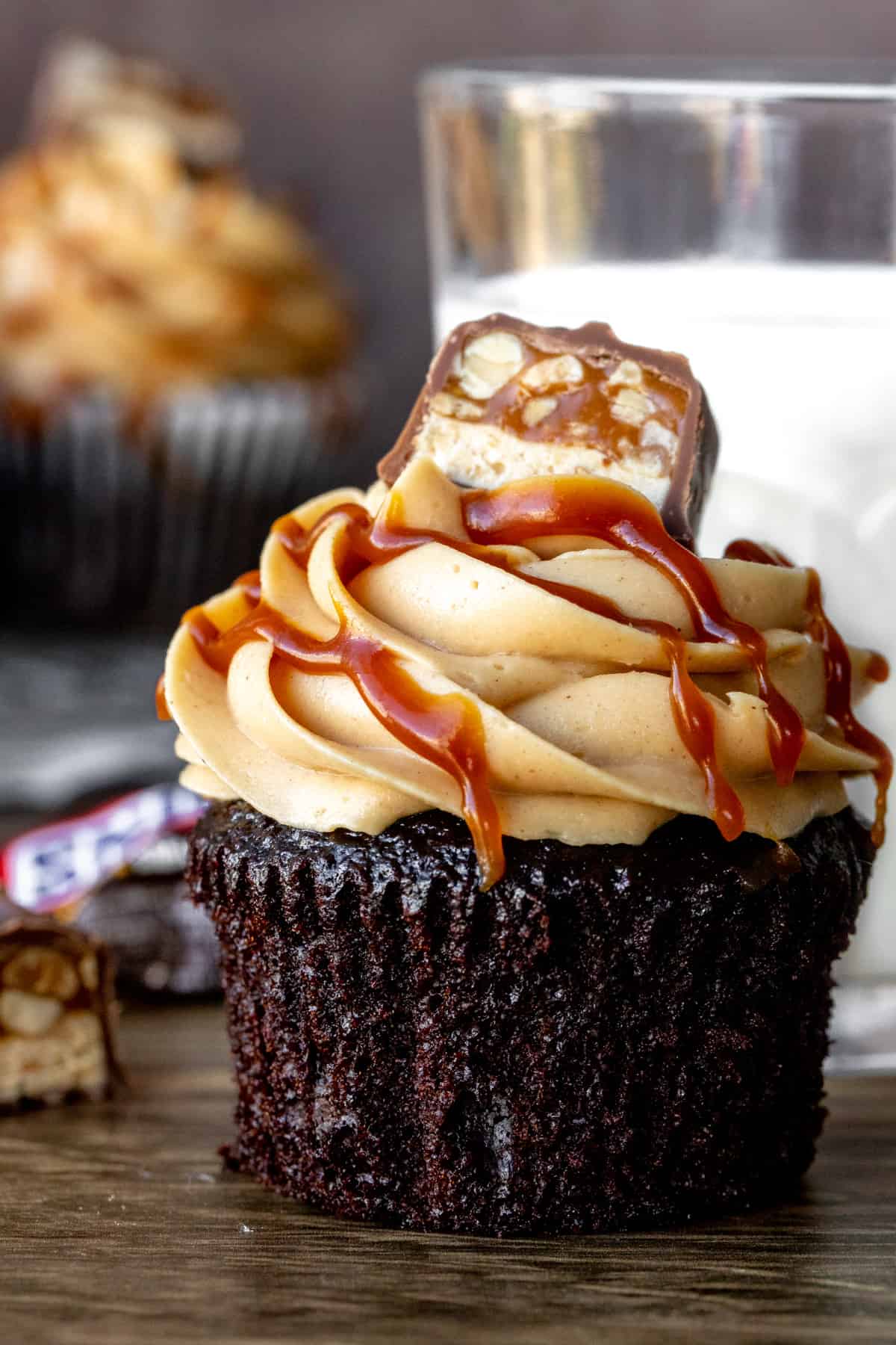 Snickers cupcakes with glass of milk