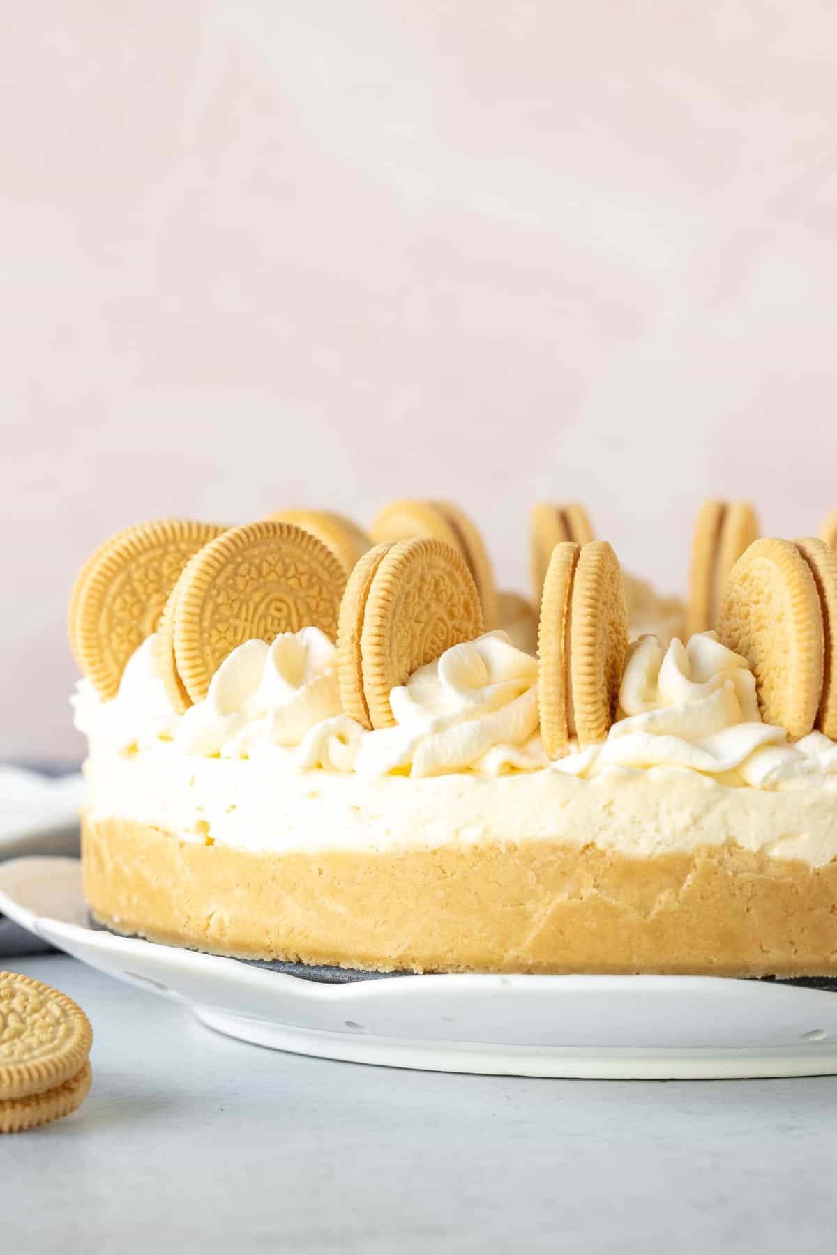 9-inch round no-bake Golden Oreo Cheesecake, decorated with whipped cream and cookies