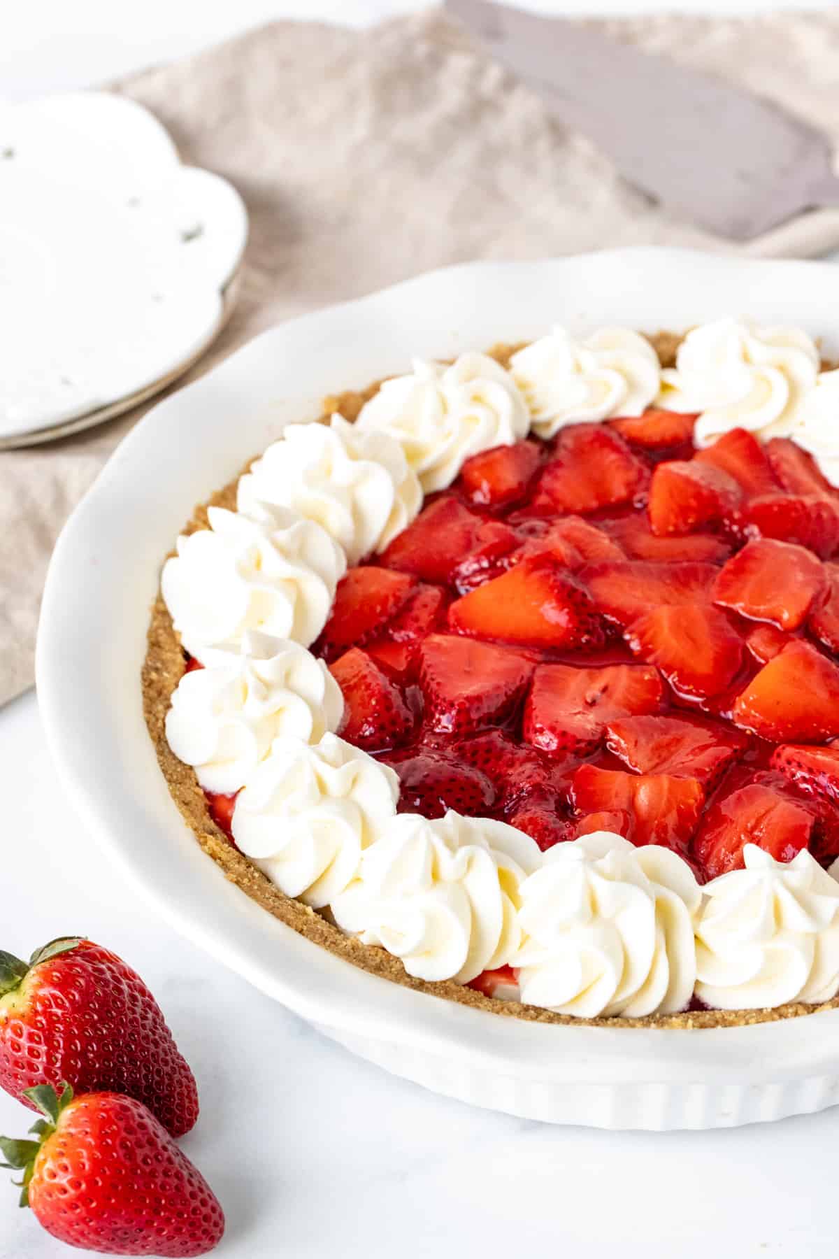 Strawberry cream cheese pie, with whipped cream around the edges