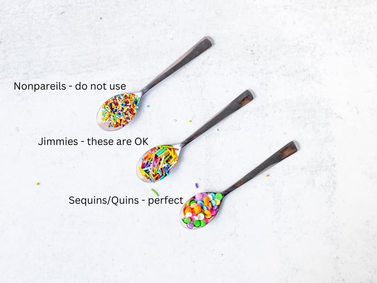 Three spoons holding 3 types of sprinkles