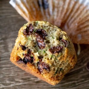 Zucchini muffin with chocolate chips broken in half