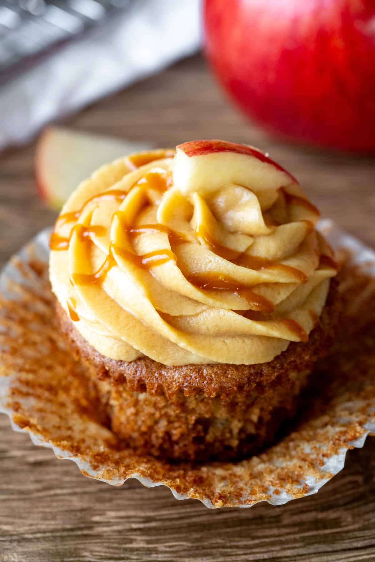 Caramel apple cupcake with muffin paper peeled bag.