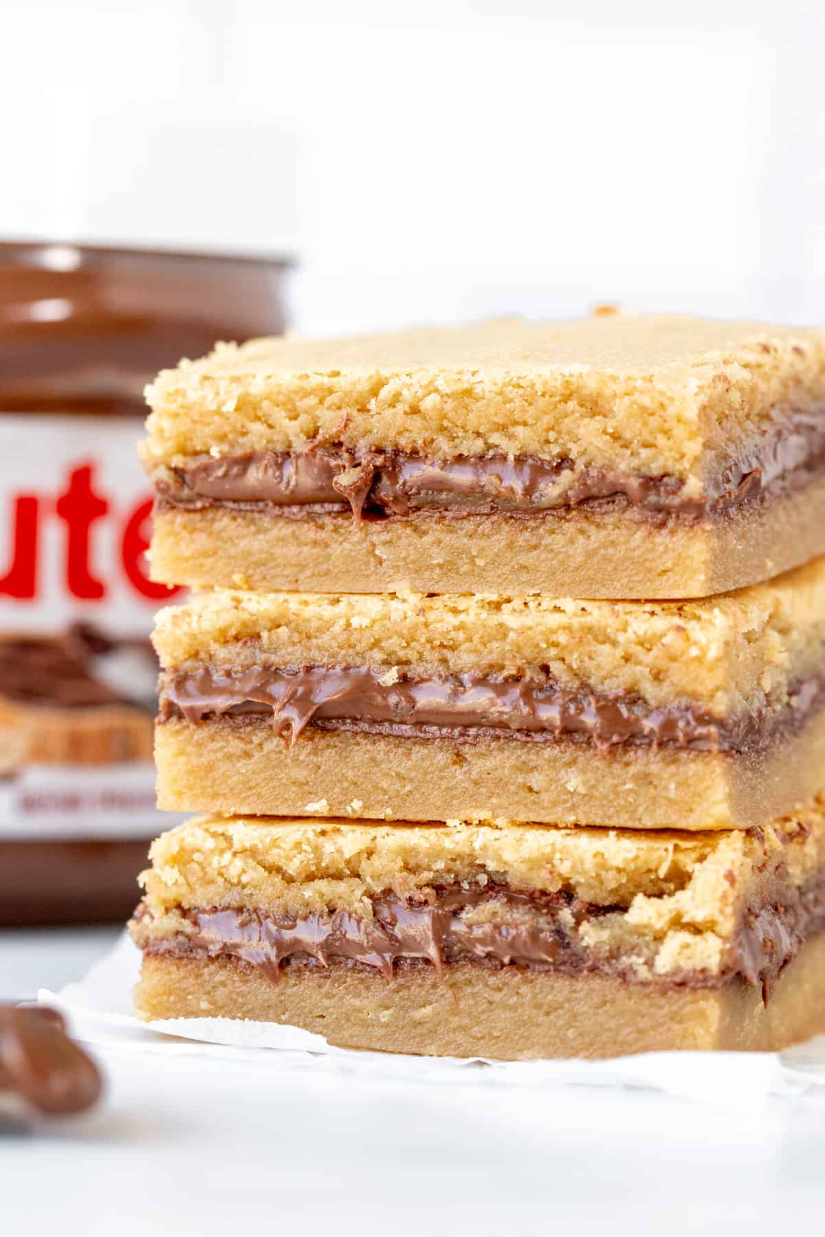 Stack of 3 Nutella stuffed blondies, one on top of each other. 