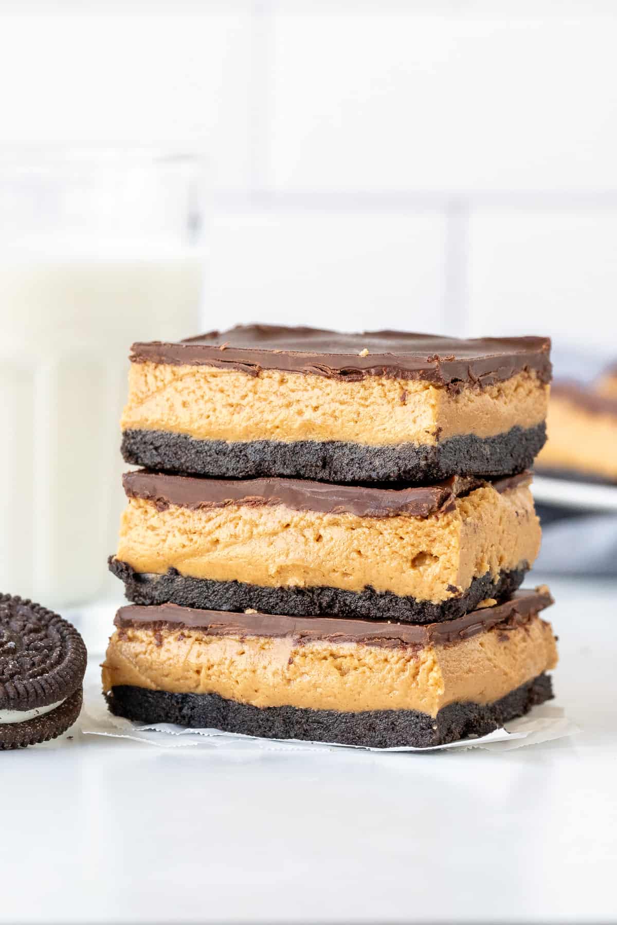 Three peanut butter Oreo bars, stacked one on top of another.