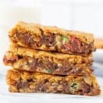 Stack of three monster cookie bars, one on top of each other